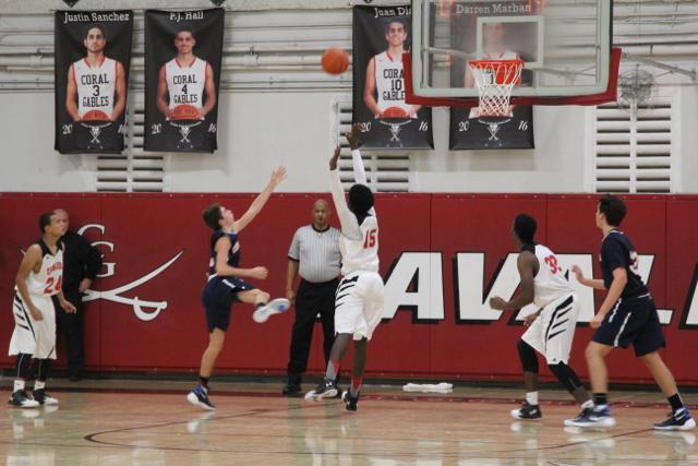 Cavs Beat Out Explorers in Varsity Basketball