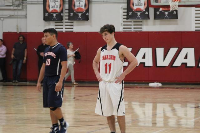 Cavs Beat Out Explorers in Varsity Basketball