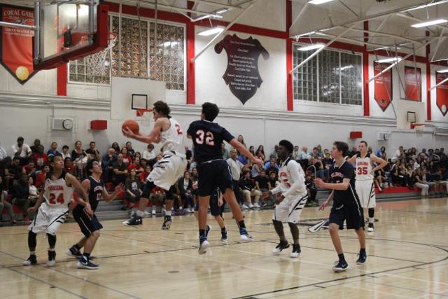Cavs Beat Out Explorers in Varsity Basketball