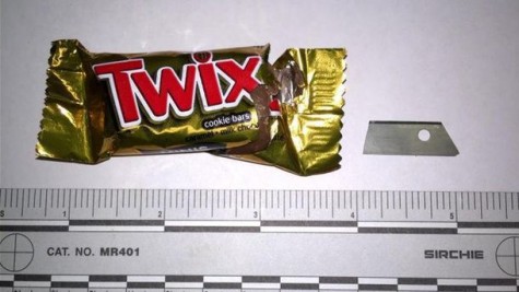 A razor blade found hidden inside a Twix bar.