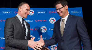 Gables Alum Ross Atkins, right, shakes hands with Blue Jays President  Mark Shapiro.