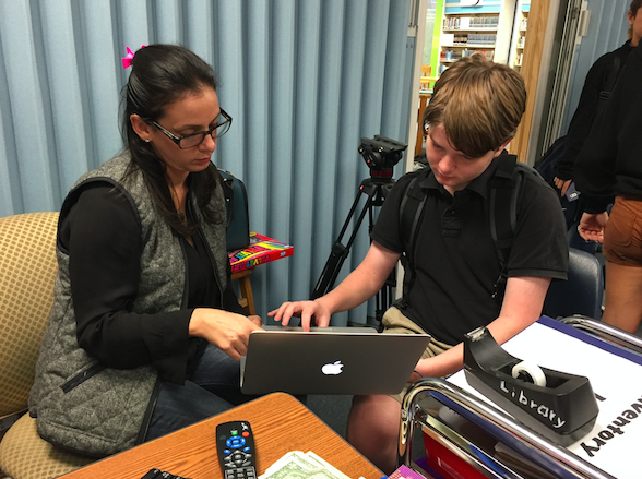 Ms. Camacho helping one of her TV production students 