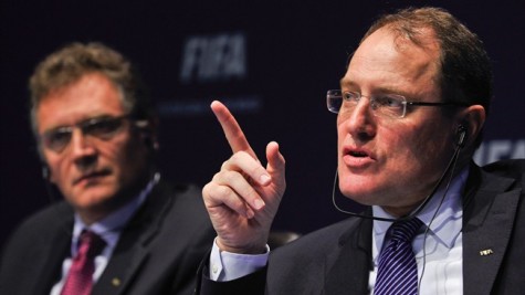 Chairman of FIFA's ethics committee Claudio Sulser (R) gestures next to FIFA Secretary General
