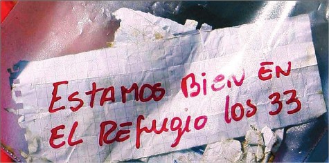 This the message sent by the miners, it reads "Estamos bien en el refugio los 33" which translates to "We're alive in the refuge, the 33".