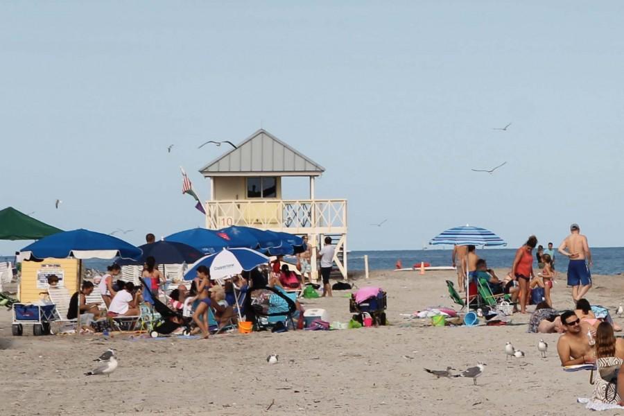 Miami tourists sunbathe on a sunny Saturday afternoon at Crandon Beach.