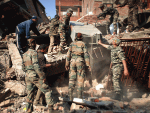 Indian soldiers sorting through the debris in the aftermath of the earthquake.