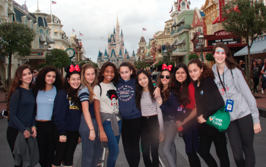 Freshmen enjoy taking a group picture alongside Cinderellas Castle.