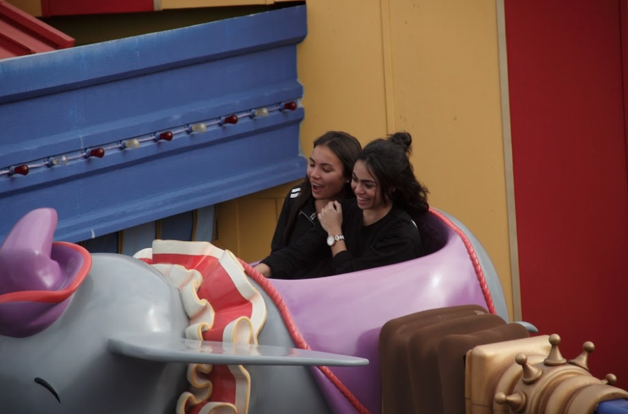 Class of 2019 students laugh as they enjoy the Dumbo the Flying Elephant ride.