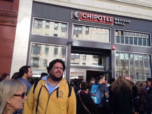 People crowd around Chipotle, a fast food chain that uses anti-biotic free meats.