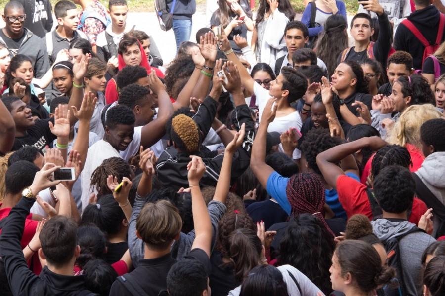 Students congregate as the music blares in front of the Moore Building.