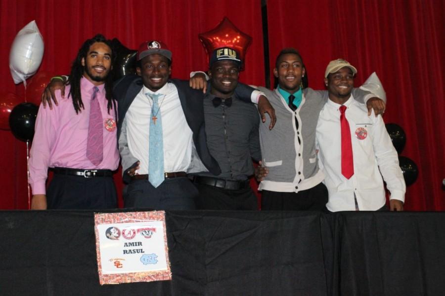 Five Cavalier football players signed with their respective colleges on national signing day. 