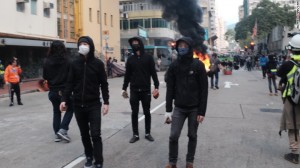 Protesters that were ready to toss bricks at police officials.