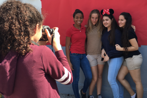 Friends pose at the CAF&DM photo booth.