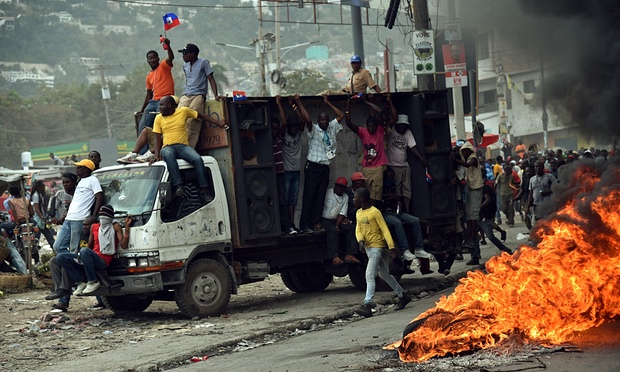 Demonstrators stand in protest against elections frauds. 