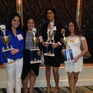 Parliamentary Procedure team strikes a pose with their trophies. 