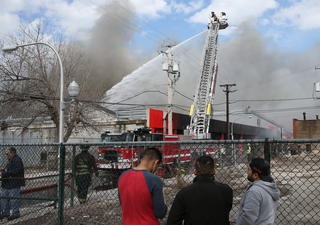 Crews at the flea market trying to stop the fire.