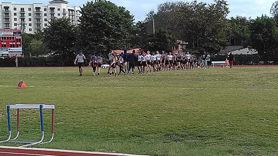 The teams congratulate one another on a great game.