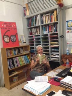 Ms.Roman enjoying one of Shakespeare's works, King Lear.