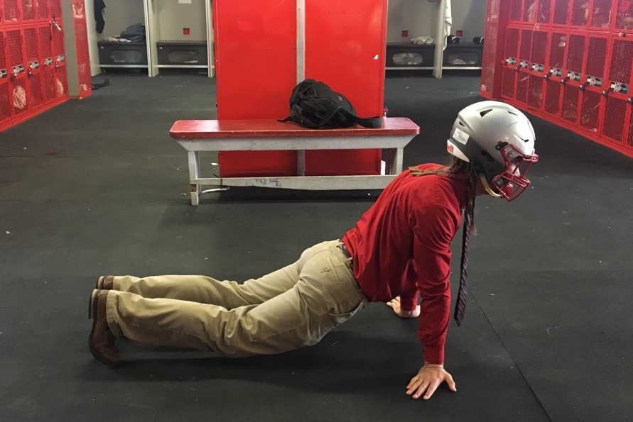 Senior Daniel Enriquez does a yoga pose.