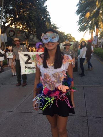 Junior _____ walks the parade dressed as Coral Reef. 
