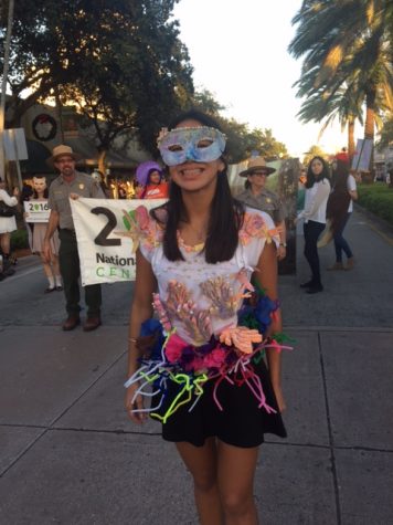 Junior _____ walks the parade dressed as Coral Reef.