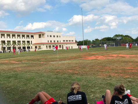 The Lady Cavaliers watch the boys during their game, preparing to take on the competition.