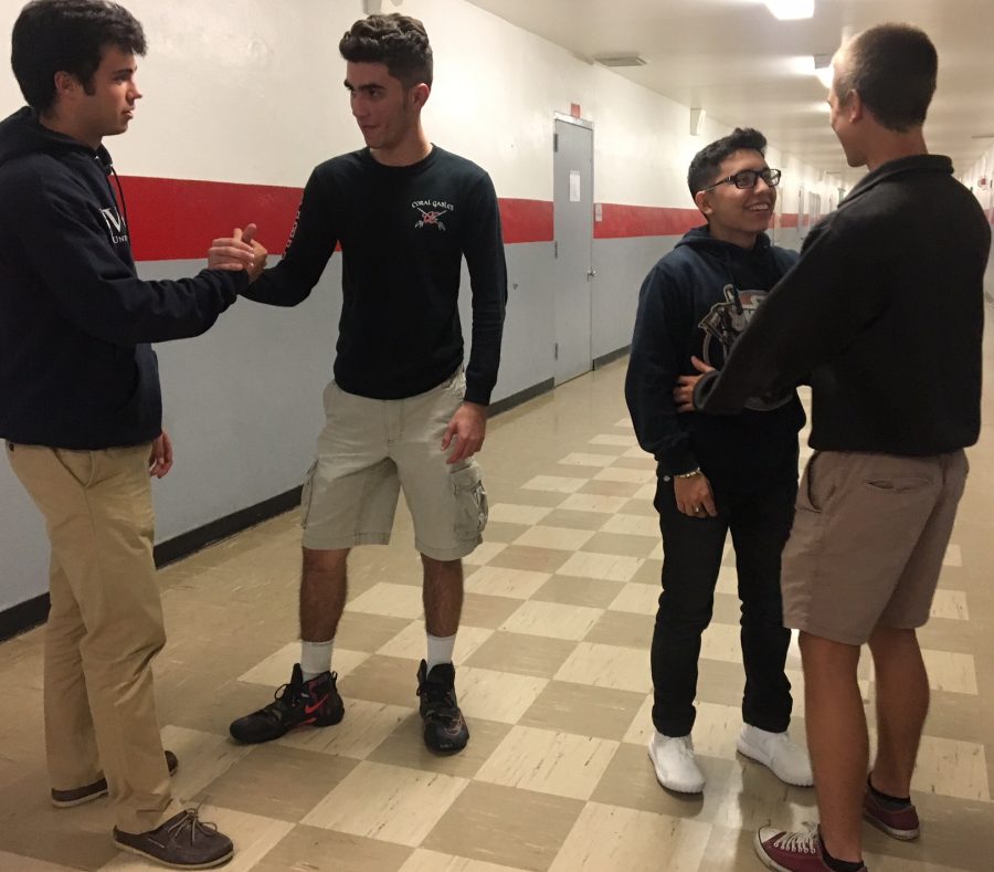 Seniors Alex Rabell, Erick Sarmiento, Oscar Barrios and Jose Puig demonstrating what the halls of an all boys school may look like.