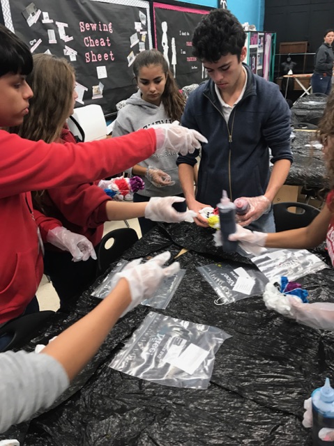 The junior class prepping for their shirts to start personalizing them. 