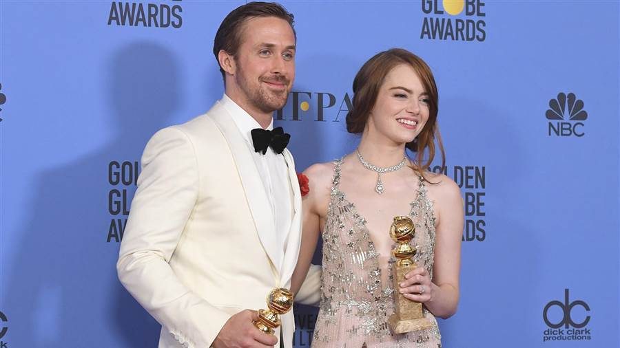 Ryan Gosling and Emma Stone pose together after winning Golden Globes for "La La Land."