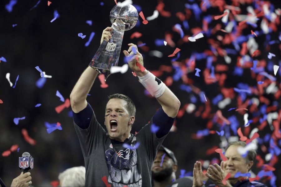 Tom Brady holds the Lombardy trophy after a 25 point comeback. This is his fifth Super Bowl win.