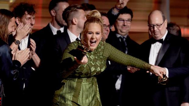 Adele receiving one of her several Grammy awards.