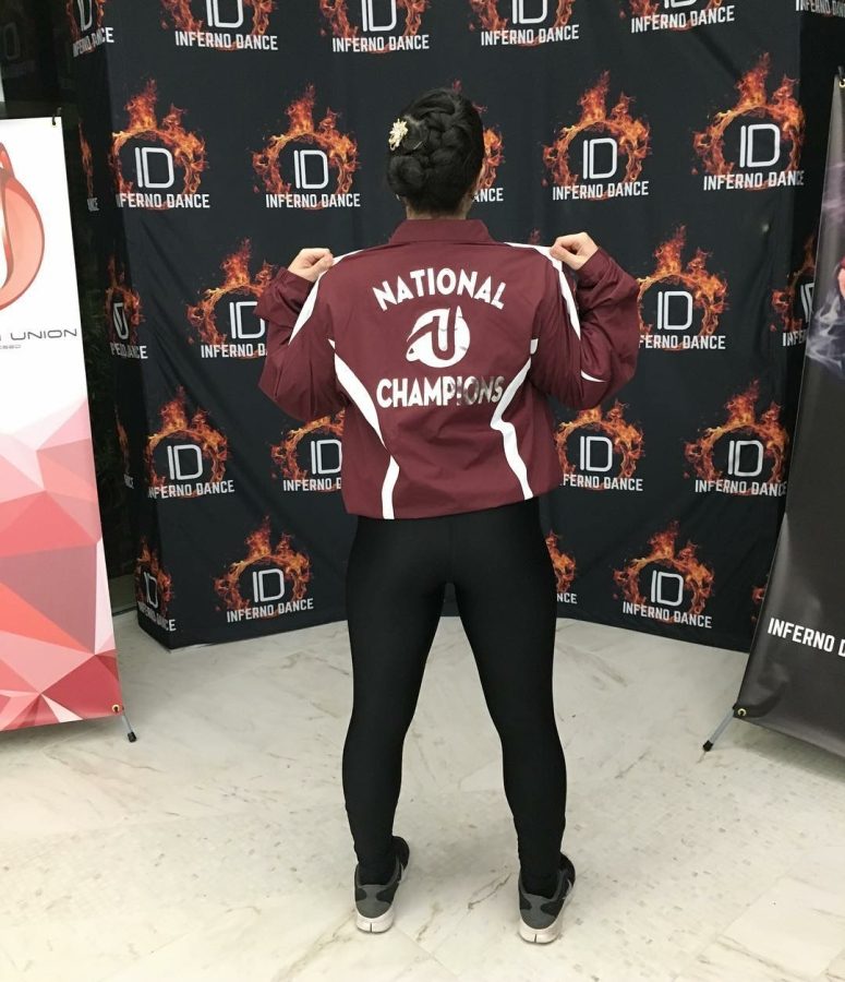 Gablette, Miriam Fong, showing off the National Champion jacket that each dance member received. 