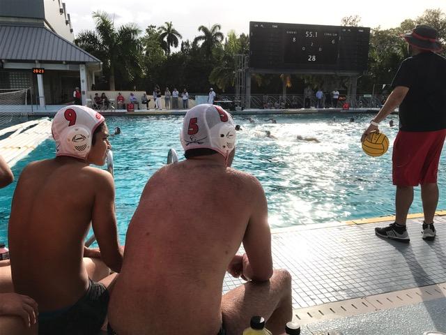 Teammates watch as the team faces off against the Ransom Raiders.