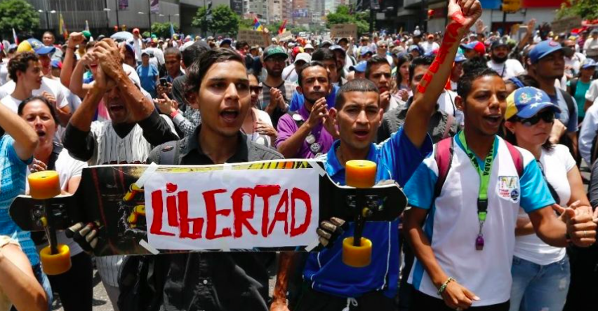 "Liberty" the sign reads, as citizens block the streets during protests. 