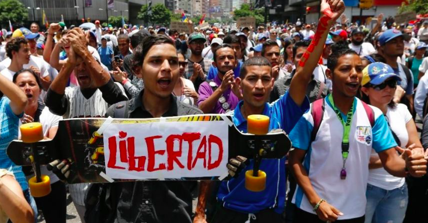 Liberty the sign reads, as citizens block the streets during protests. 