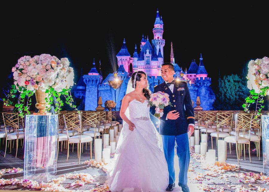 Ruby and Eric from Freeforms Disney Fairytale Wedding special as they walk down the aisle together.