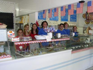 The long line of  customers awaiting a taste of ice cream display the prominence of the ice cream shop.
