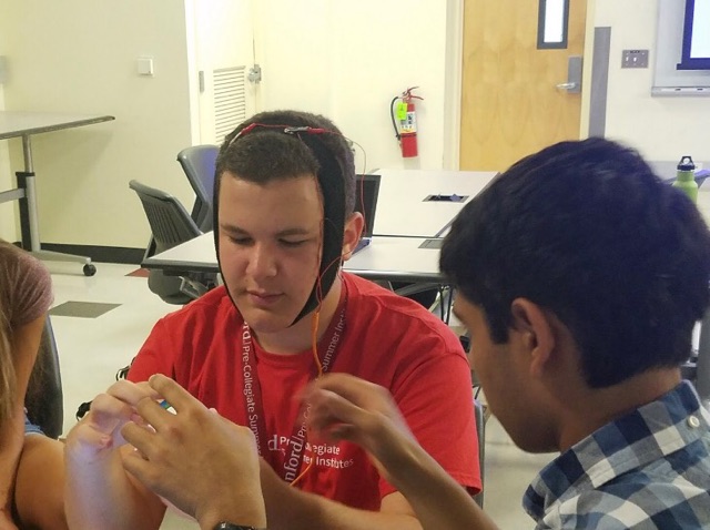 Perez performs an EEG test on himself.