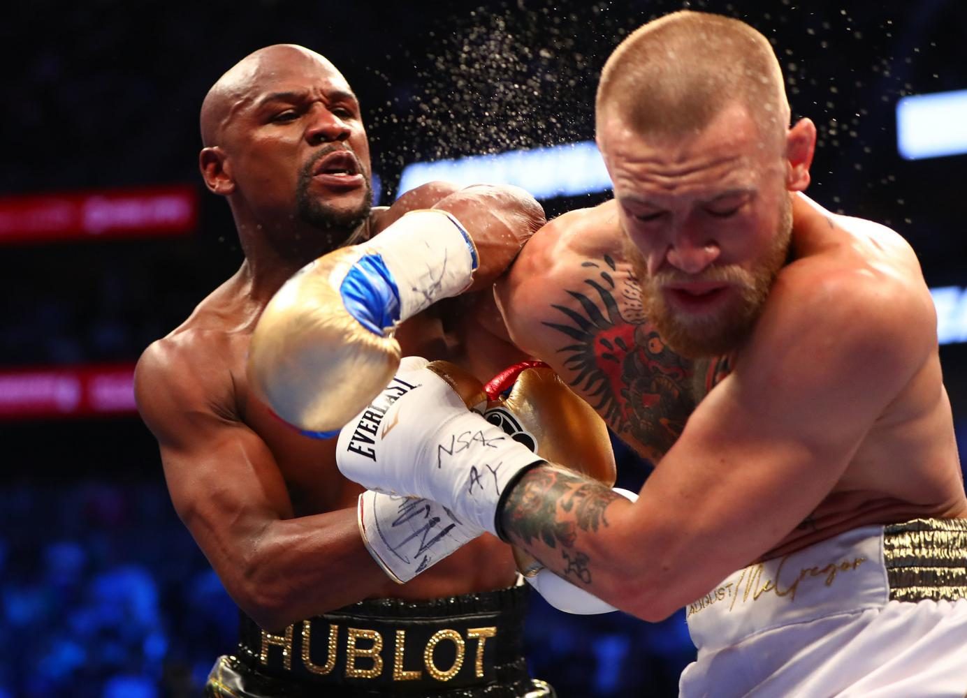Floyd Mayweather landing a punch against Conor McGregor.