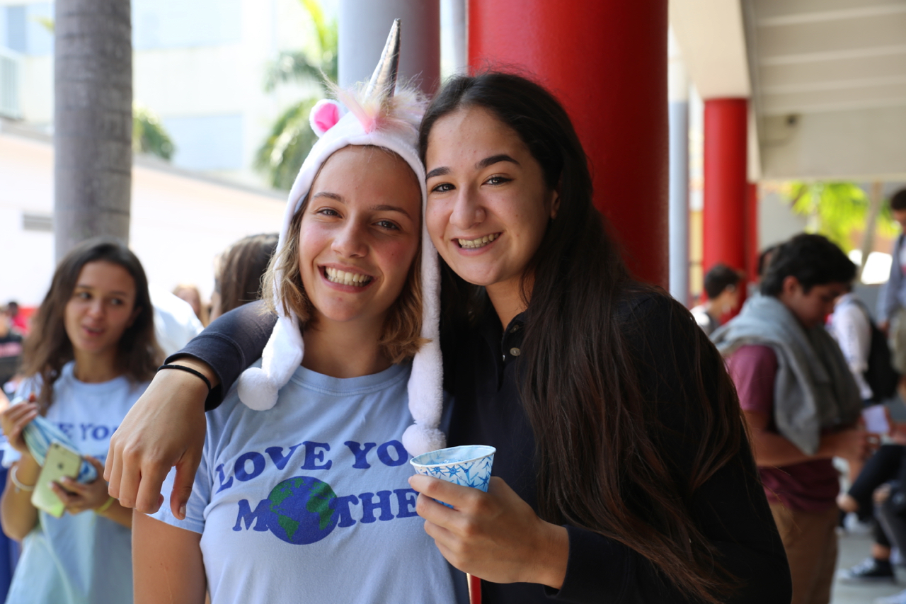 Senior and Gables Earth President Ximena Puig smiles for a picture with junior Isabella Morina.