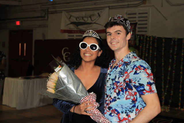 Luis and Henessy, Homecoming King and Queen pose for a photo.