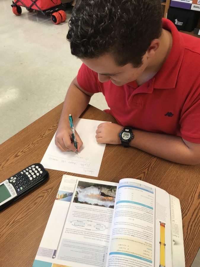 Alain Perez studies for a Chemistry quiz. 