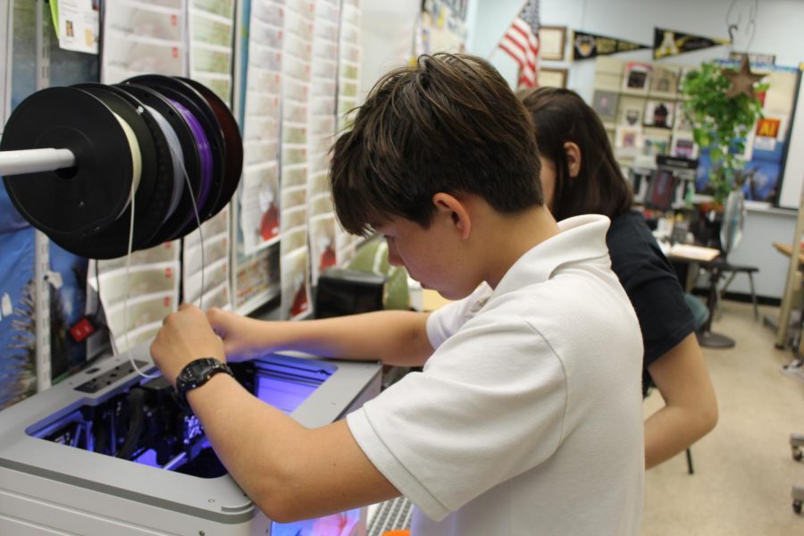 Students working on the 3D printer.