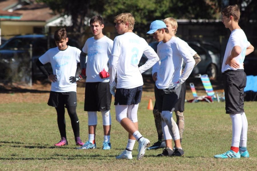 The Snow Leopards Huddle on the field preparing for a match.