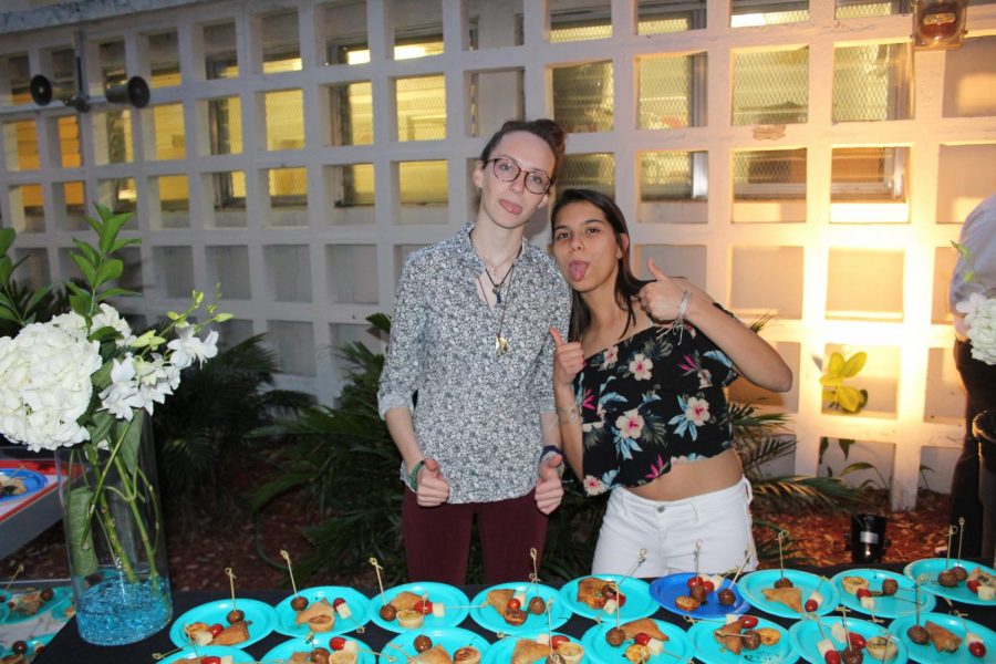 Volunteers smile for a picture.