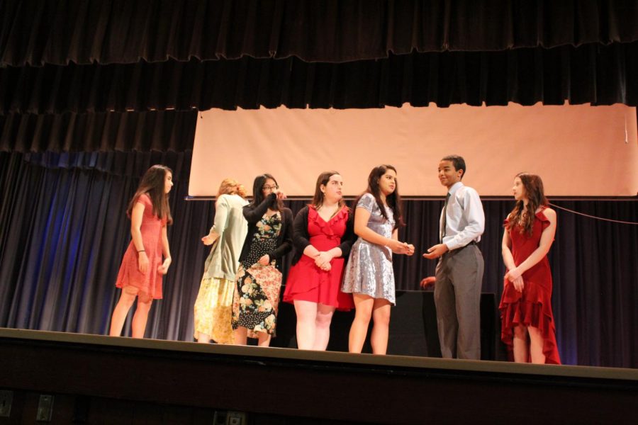 IB Junior students walk across the stage to get pinned.