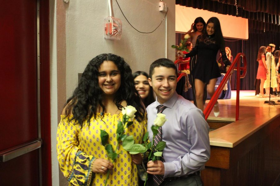 IB Junior students walk across the stage to get pinned.