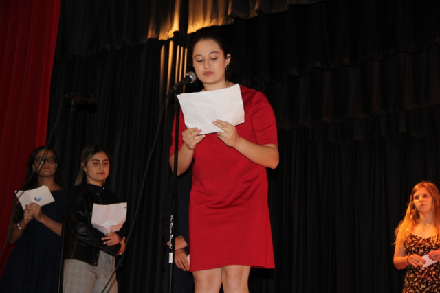 IB senior Yara Faour congratulates the class in a foreign language.