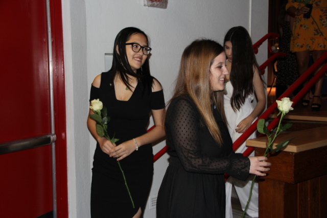 IB Juniors smile for a picture after being pinned.