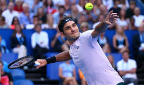 Roger Federer, winner of the Mens Singles at the Australian Open, prepares to hit a tennis ball.